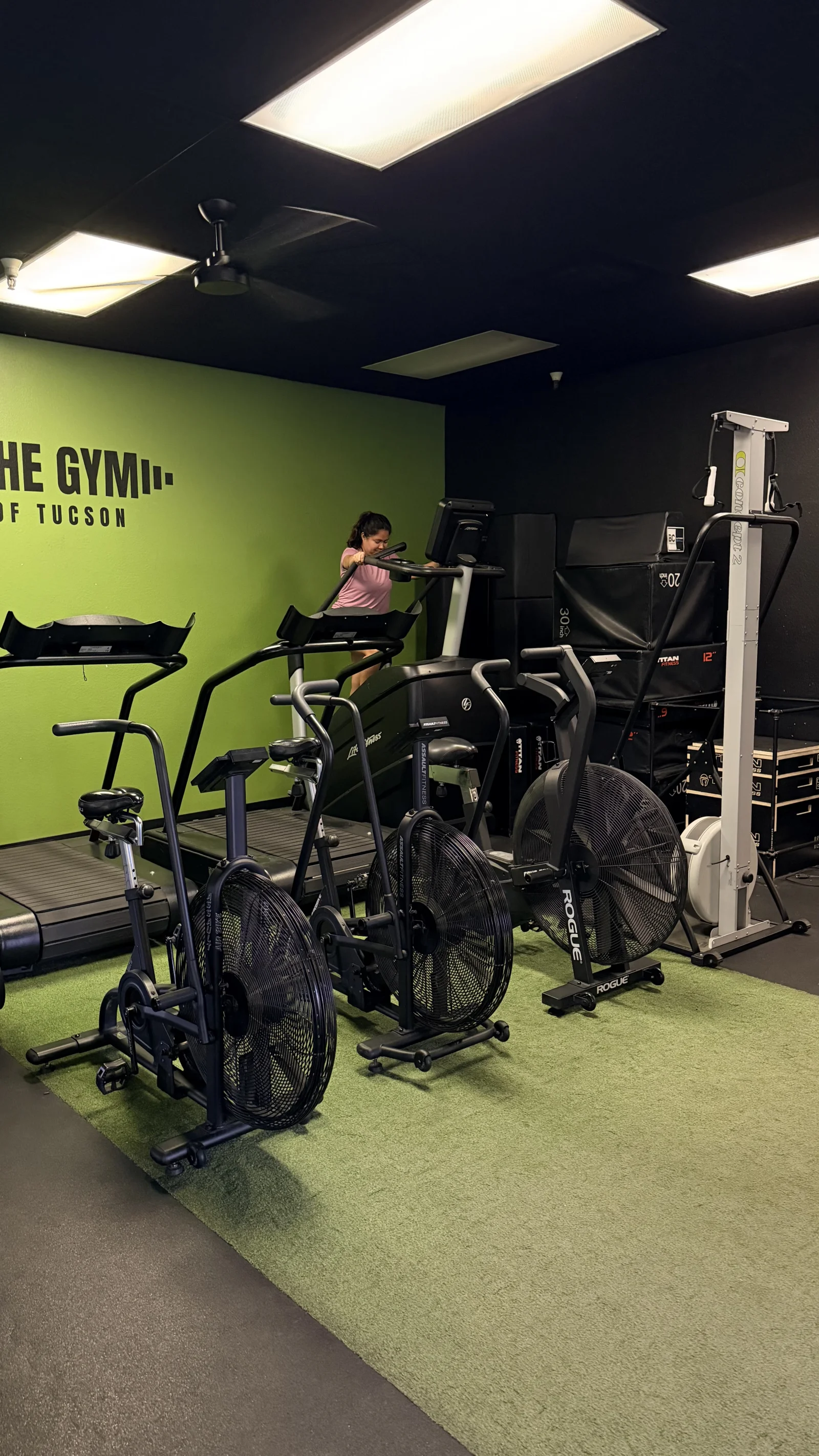 Conditioning room with air bikes and treadmills at The Gym of Tucson
